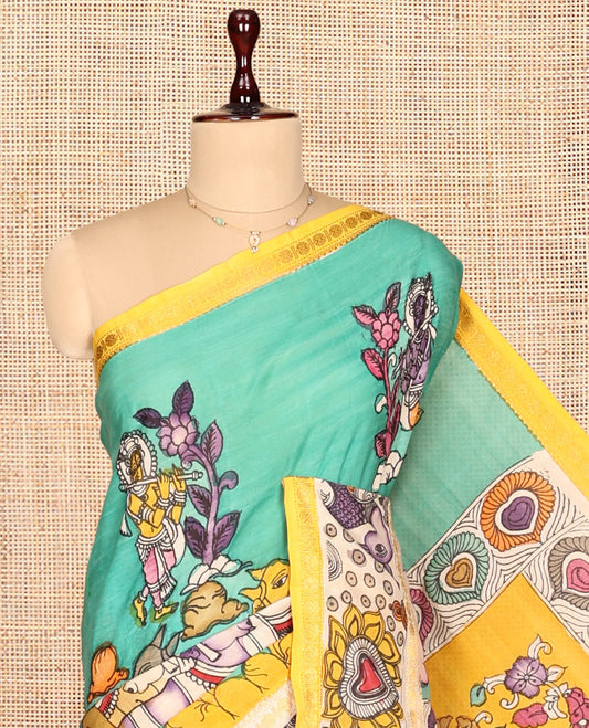 Turquoise Kalamkari Silk Saree, Enthralled with Human Figurines, a Contrast Peacock Border, Kalamkari Pallu, and a Contrast Blouse