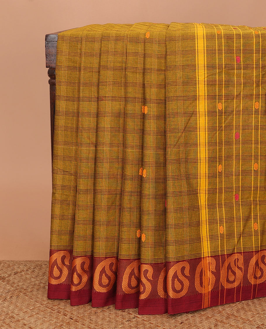 Green buttas and checked Chettinad cotton saree, contrast paisley buttas border, and pallu of stripes, and buttas