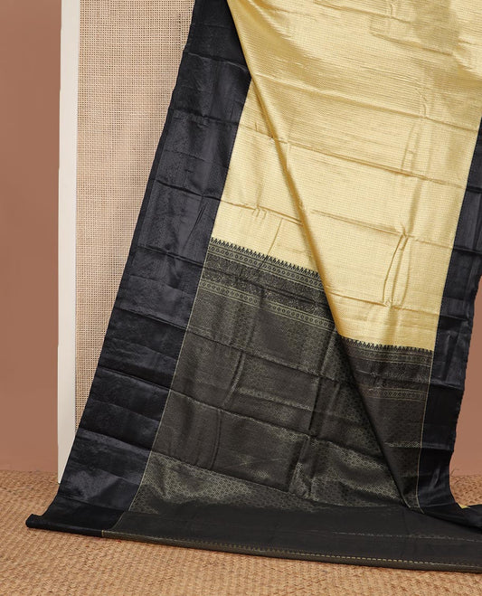 Yellow micro checked style woven budget silk saree, contrast black thread woven border of traditional motifs, and jaal pallu