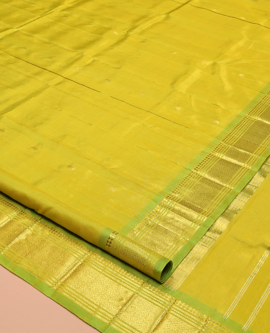 Green Kanchipuram Silk Saree Featuring Zari Buttas, Complemented by a Contrast One-Sided Border of Panner Sombu, Banaras, Muthu, and Jaal Design, Zari Design Pallu, and No Blouse
