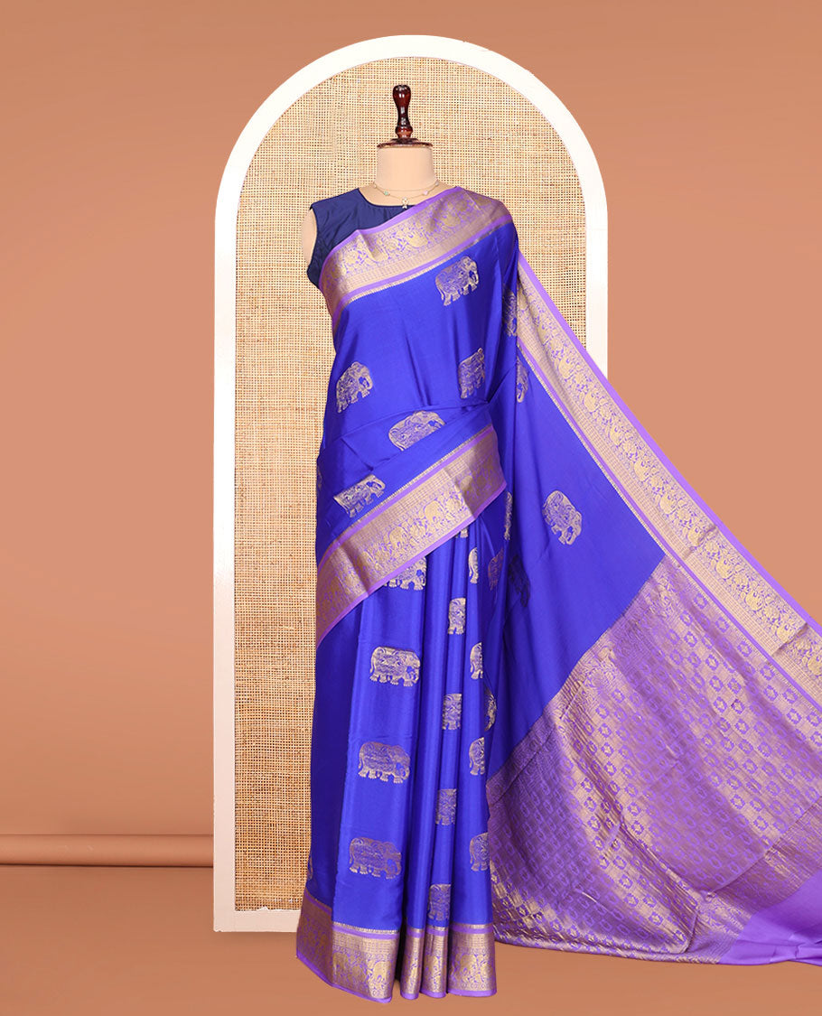 Blue Mysore Silk Saree, Mesmerized with Elephant Buttas Across Its Body, Complemented by Contrast Traditional Zari Border of Peacock-Elephant Designs, Intricately Designed Pallu, and Paired with a Contrast Blouse