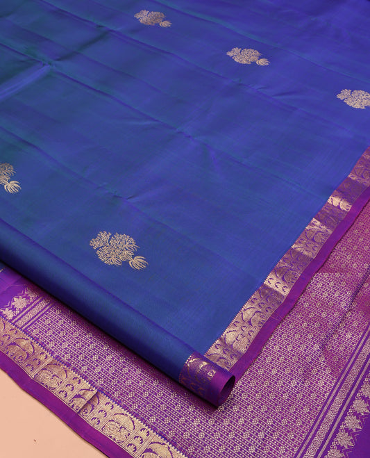 Blue Kanchipuram Silk Saree, Uniquely Designed with Zari Buttas on Its Body, Complemented by Contrast Border of Rekku, Thazampoo Rekku, and Annam Designs, Intricately Designed Pallu, and Paired with a Contrast Blouse