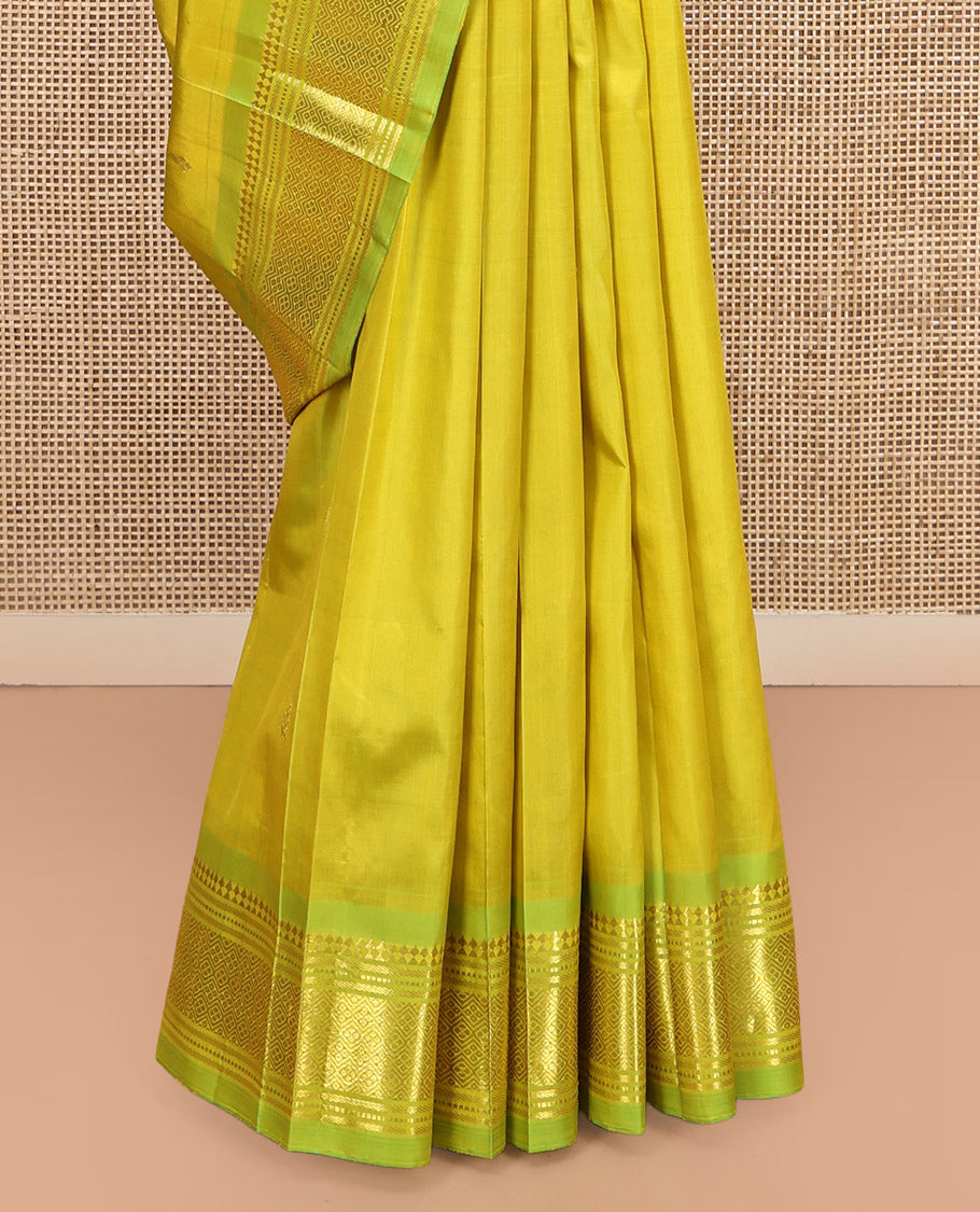 Green Kanchipuram Silk Saree Featuring Zari Buttas, Complemented by a Contrast One-Sided Border of Panner Sombu, Banaras, Muthu, and Jaal Design, Zari Design Pallu, and No Blouse