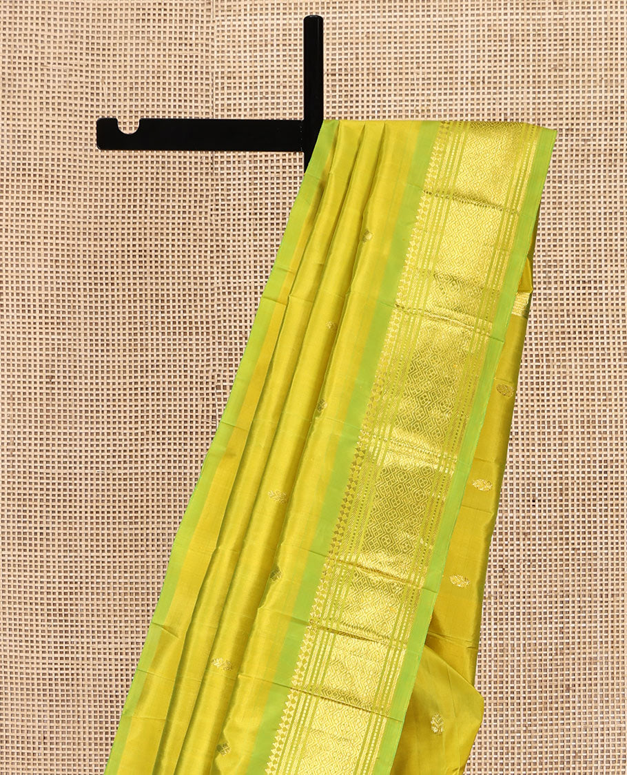 Green Kanchipuram Silk Saree Featuring Zari Buttas, Complemented by a Contrast One-Sided Border of Panner Sombu, Banaras, Muthu, and Jaal Design, Zari Design Pallu, and No Blouse
