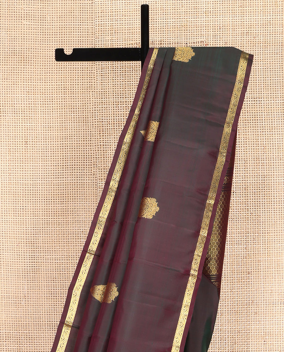 Brown Kanchipuram Silk Saree, Elevated with Zari Buttas All Over Its Body, Highlighted by Zari Piping Border, Grand Scallop Design Pallu, and Paired with a Matching Blouse