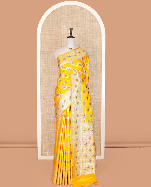 Yellow meenakari floral creeper design with stone work banarasi silk saree, floral creeper design stone work border, and pallu of intricate designs