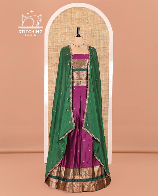 Purple and Green Semi-Banarasi Half-Saree Featuring Zari Buttas Skirt, Complemented by Contrast Rettai Pettu, Traditional Border of Floral Creeper Designs, Paired with a Matching Blouse, and a Satin Georgette Embroidered Scallop Dhavani