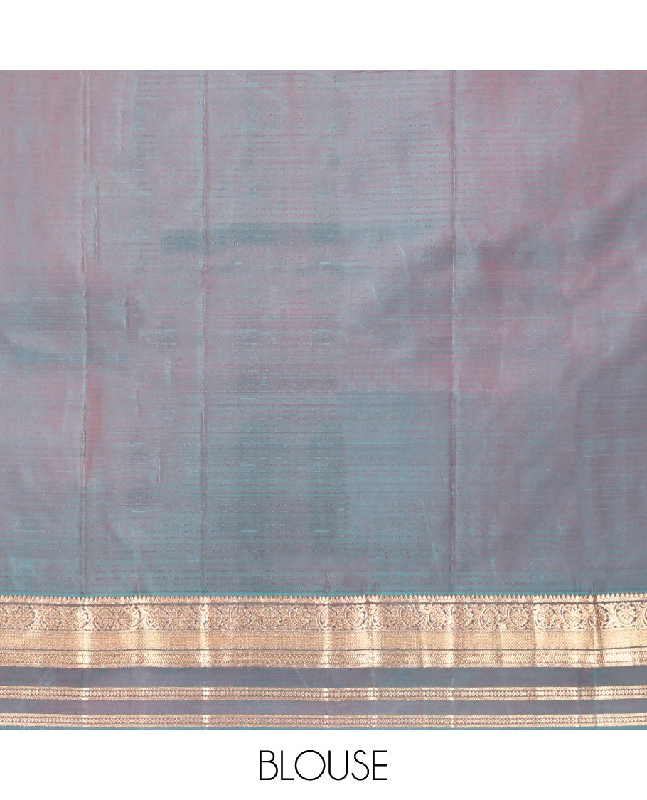 Red Vasundhara Silk Saree, Spotlighted with Zari Buttas and Stripes, a Contrast Rettai Pettu Border of Thilakam, Kamalam, Banaras, and Muthu Designs, Jaal Pallu, and Contrast Blouse