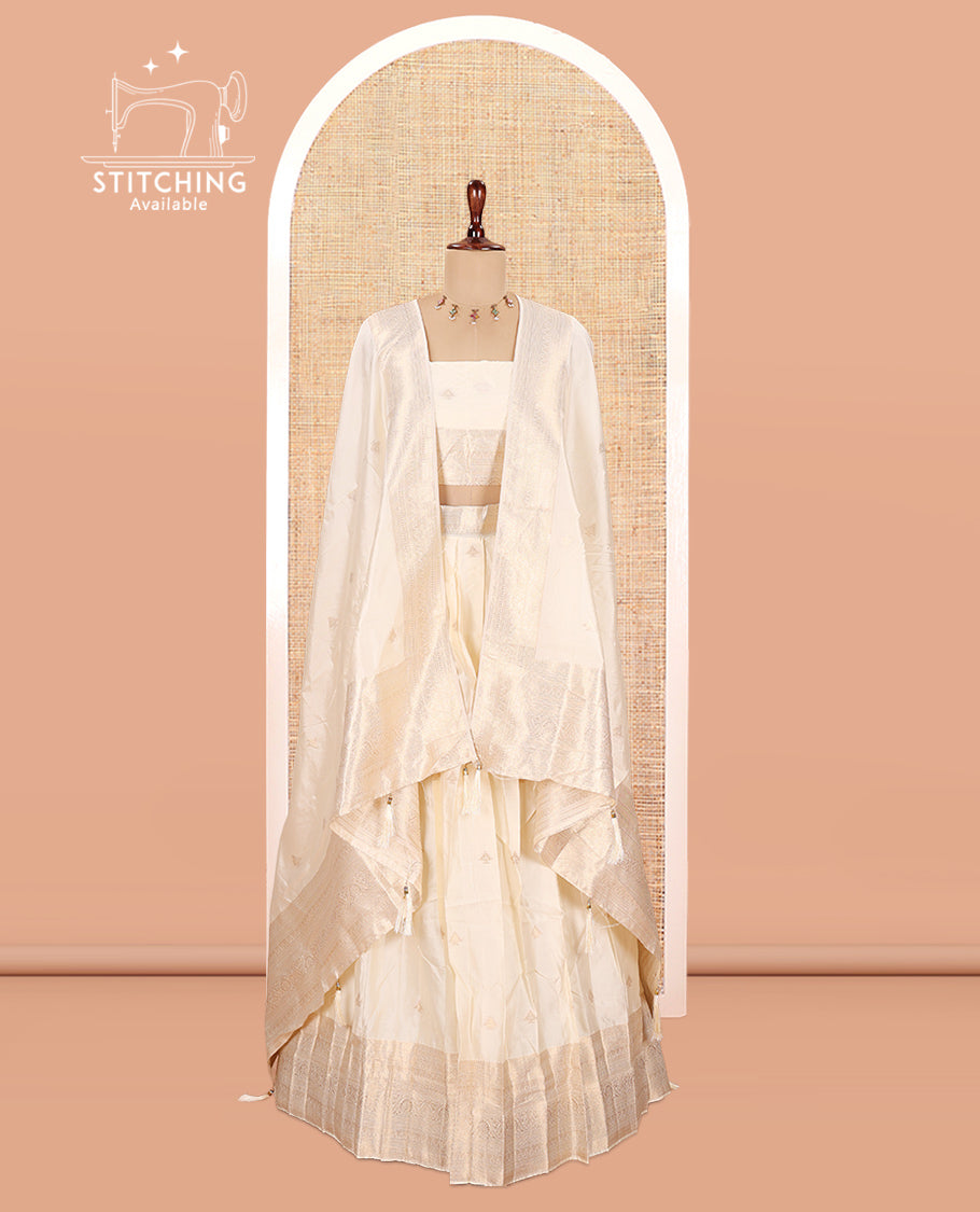 Cream Semi-Banarasi Half Saree, Zari Buttas Top, a Matching Blouse, and Intricately Designed Dhavani
