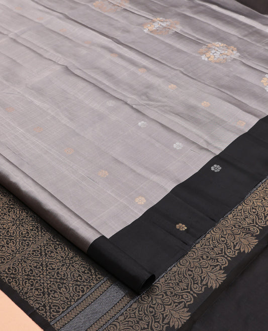 Grey Mayuri Lite Silk Mix Saree, Woven with Zari Buttas, Complemented By Contrast Border of Floral Buttas, a Grand Pallu, and a Contrast Blouse