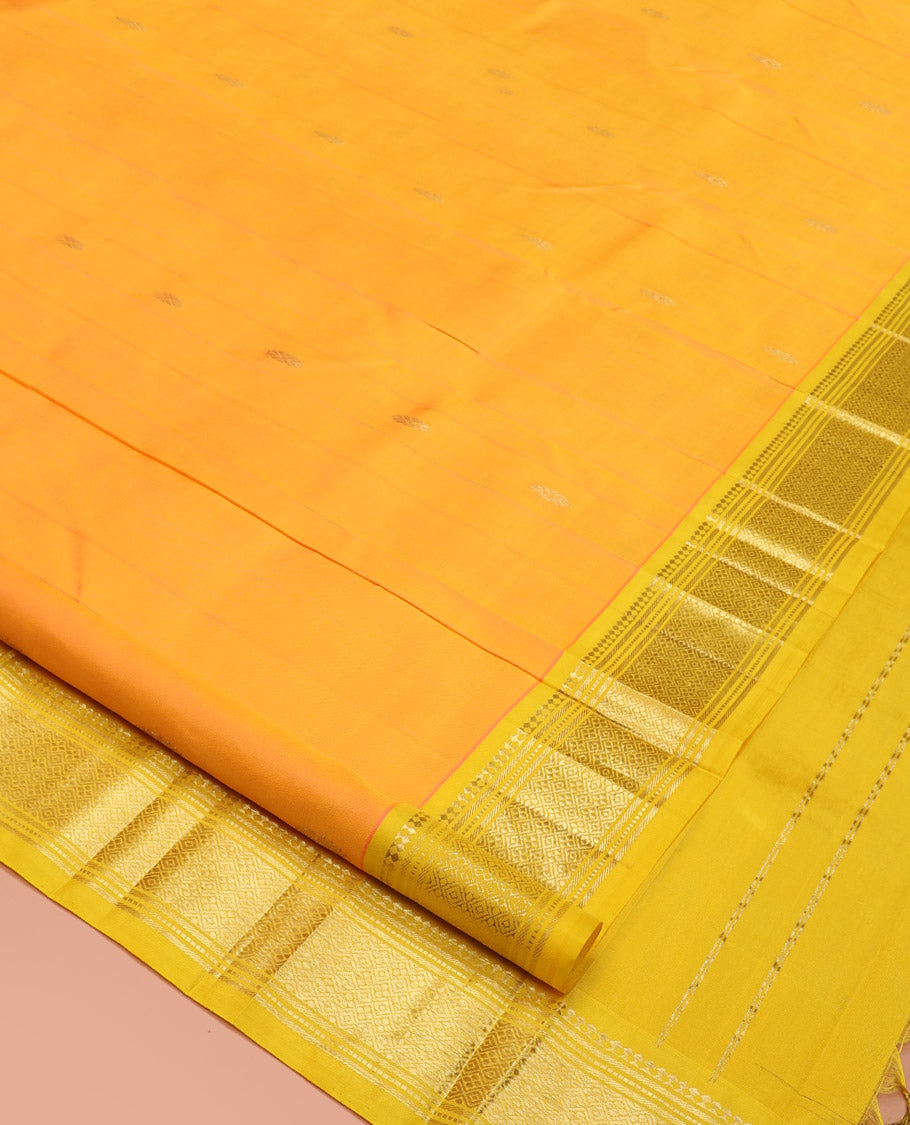 Yellow Kanchipuram Silk Saree, Subtly Sparkled with Zari Buttas, a Contrast One-Sided Border of Panner Sombu, Banaras, Muthu, and Jaal, Zari-Woven Pallu, and No Blouse