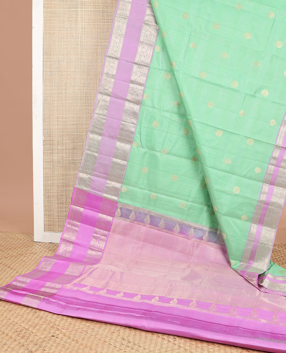 Light green striped , buttas silk saree with contrast rettai pettu border of thilakam mokku, paun, muthu design & zari design pallu