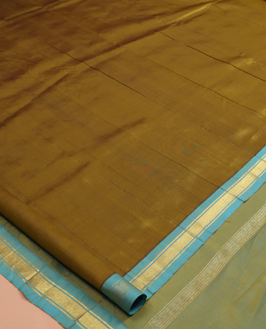 Green Plain Kanchipuram Silk Saree, a Contrast Zari One-sided Border, Zari Striped Pallu, and No Blouse