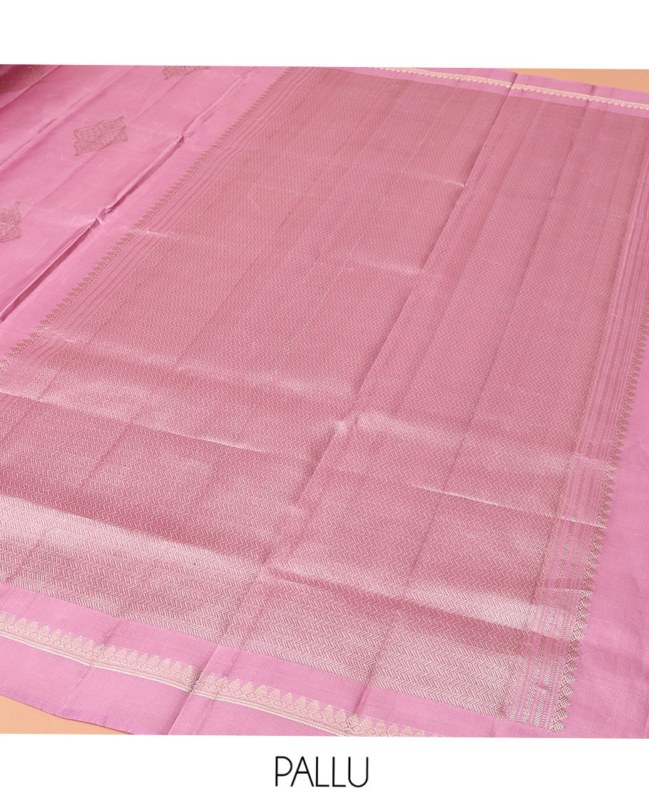 Pink Mayuri Soft Silk Saree, Embellished with Buttas All Over Its Body, Subtly Sparkled Kal Erangina Border of Thilakam Mokku Designs, Intricately Woven Pallu of Chevron Designs, and Paired with a Matching Blouse