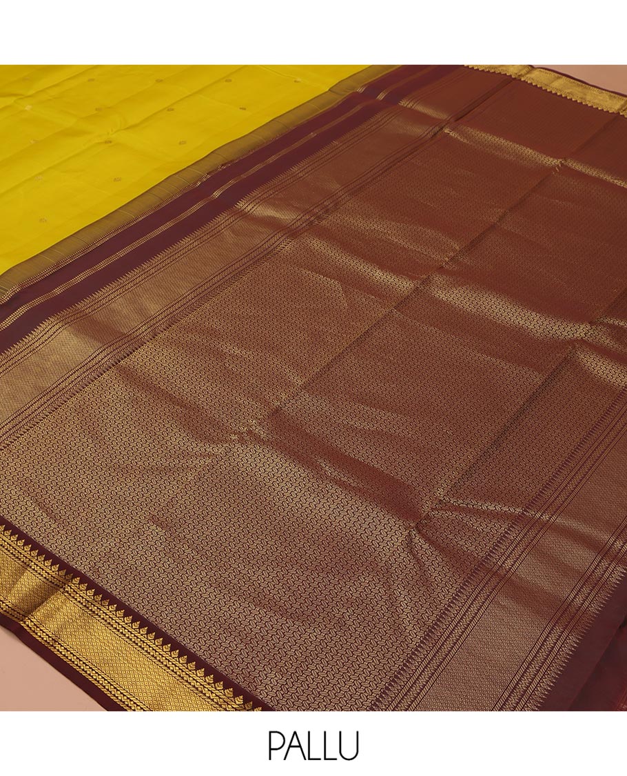 Yellow Vasundhara Silk Saree, Woven with Zari Buttas All Over Its Body, Complemented by a Contrast Korvai Border of Thilakam, Banaras, Neli, and Mayil Kann Designs, Grand Pallu, and Paired with a Contrast Blouse