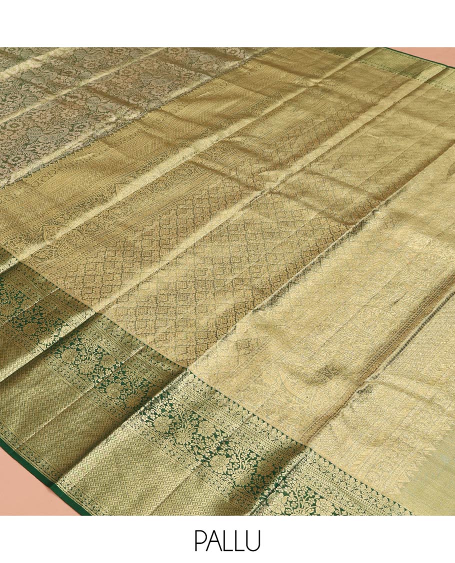 Green Kanchipuram Tissue Silk Saree, Majestically Detailed with Jacquard Designs on Its Body, Highlighted by a Zari Border of Jaal, and Floral Designs, Intricately Designed Pallu, and Paired with a Matching Blouse