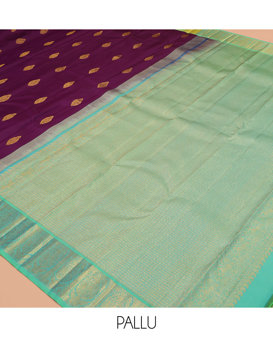Purple Kanchipuram Silk Saree, Decked Up with Zari Buttas, a Contrast Korvai Manga Border, Intricate Pallu, and a Contrast Blouse