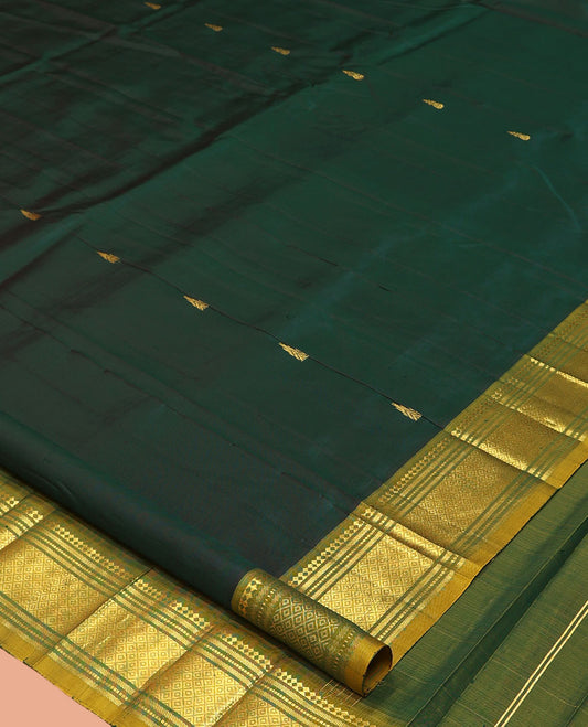 Green Kanchipuram Silk Saree, Detailed with Zari Buttas, a Contrast One-Sided Border of Paneer Sombu, Banaras, Muthu, and Mayil Kann Designs, a Zari Design Pallu, and No Blouse