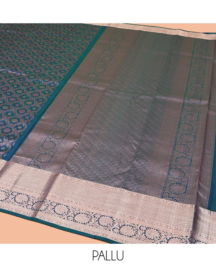 Blue Kanchipuram Wedding Silk Saree, Gleamed Up with Jacquard Designs on Its Body, Highlighted by a Zari Border of Rekku, Laddu Kamalam, Mayil Kann, and Kodi Visiry Designs, Grand Jaal Pallu, and Paired with a Matching Blouse