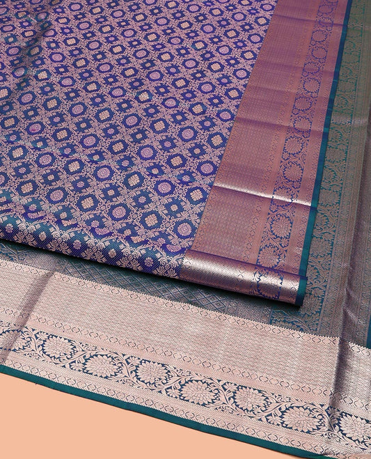 Blue Kanchipuram Wedding Silk Saree, Gleamed Up with Jacquard Designs on Its Body, Highlighted by a Zari Border of Rekku, Laddu Kamalam, Mayil Kann, and Kodi Visiry Designs, Grand Jaal Pallu, and Paired with a Matching Blouse