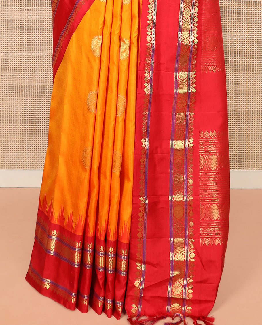 Orange Gadwal Saree Zari Accentuated with Chakra Buttas, Contrast Temple Border of Traditional Zari Designs, Pallu of Zari Designs, and a Contrast Blouse Complemented with Zari Designs