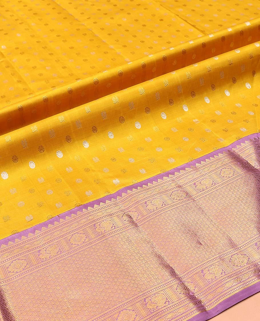 Yellow Pure Silk Half-Saree, Artfully Detailed with Mayil-Chakram Buttas on Its Skirt, Complemented by a Contrast Border of Rekku, Muthu, Diamond, Chakram, and Jaal Designs, Comes with a Contrast Blouse and a Dhavani of Jacquard Design