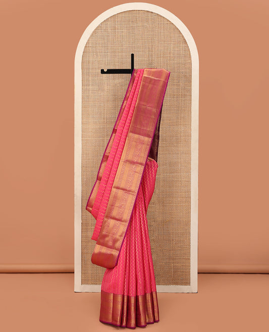 Blue Vasundhara Lite Silk Mix Saree Adorned with Zig-Zag Stripes, Complemented with a Contrast Border Featuring Rekku, Puli Nagam, Laddu Kamalam, and Mayil Designs, Pallu Adorned with the Same Border Motifs, and Paired with a Contrast Blouse