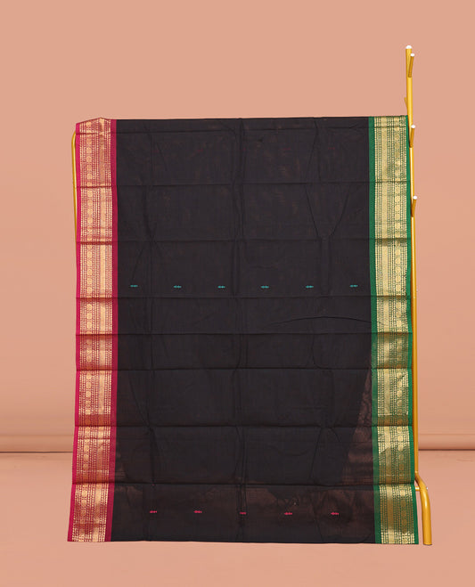 Black Chettinad Cotton Saree, Delicately Woven with Buttas All Over Its Body, Complemented by Contrast Traditional Zari Design Ganga-Jamuna Border, Pallu of Stripes, and Paired with a Matching Blouse