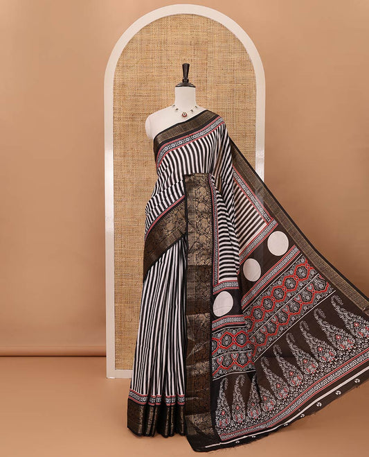 Black stripes printed soft dola saree,contrast floral creeper design zari border,Ajrakh-print pallu & blouse of floral butta & zari design