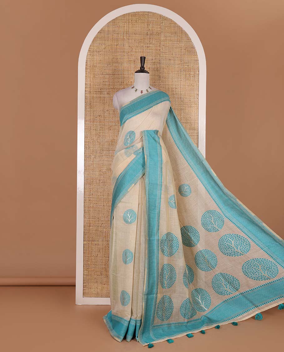 Chikku and rama blue munga cotton saree with round tree buttas, traditional thread motifs woven border, round tree motifs pallu, and thread woven blouse