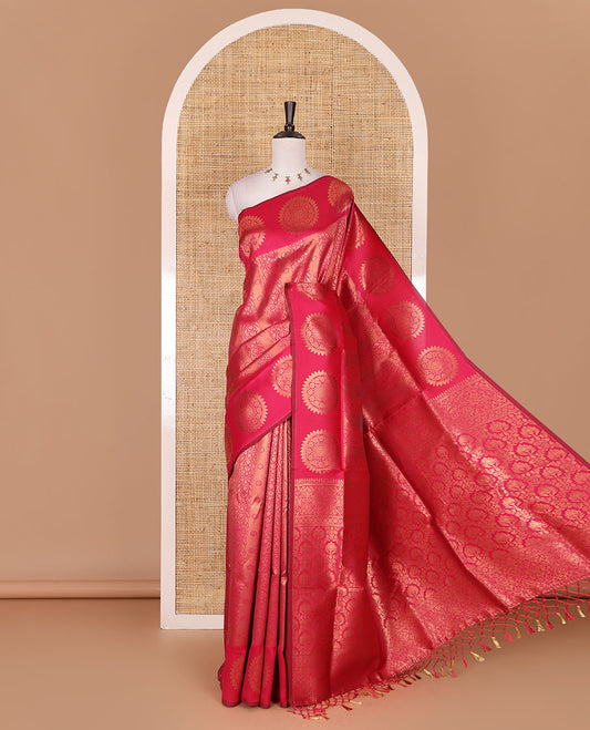 Pink jacquard kanchi tissue saree, zari chakram motifs border, intricately zari woven pallu, and a matching zari design blouse