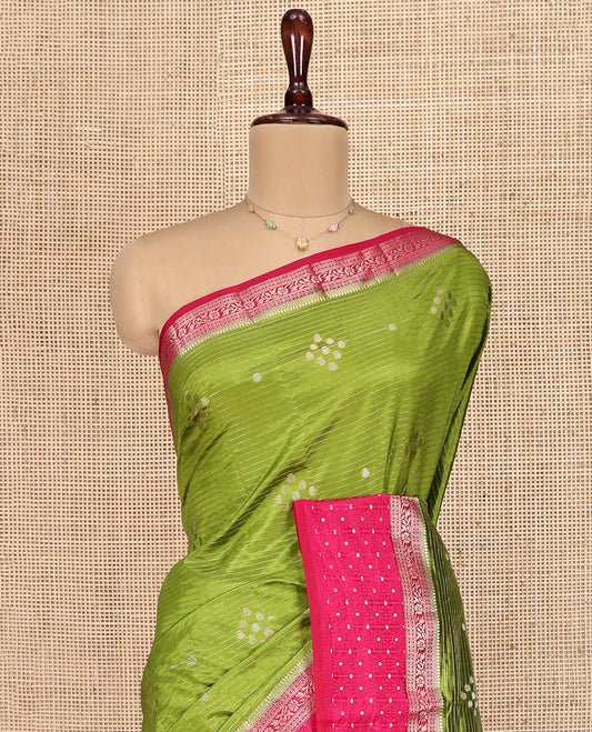 Green Semi-Banaras Dupion Saree, Detailed with Zari Buttas and Stripes, Complemented by Contrast Traditional Border, Zari Striped Pallu, and a Contrast Blouse