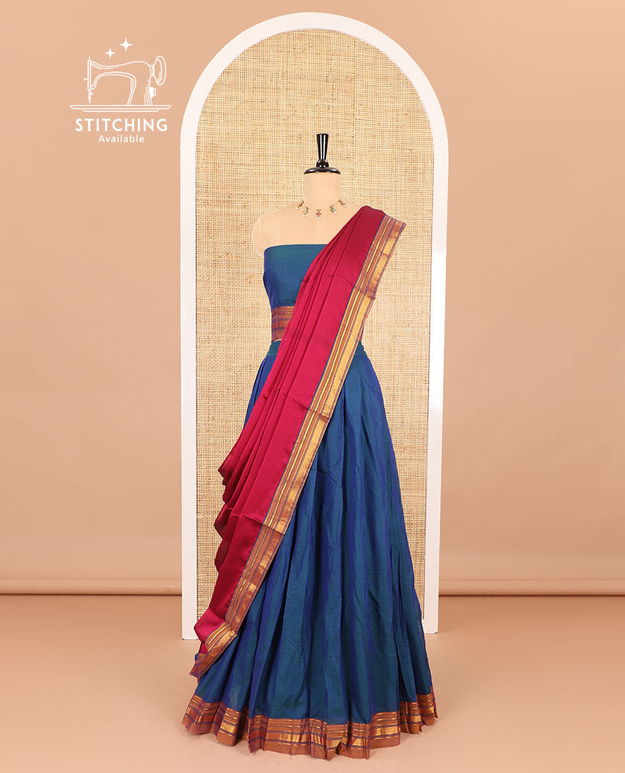 Blue half saree, plain with contrast traditional zari bordered skirt, matching blouse and a contrast peacock border dhavani
