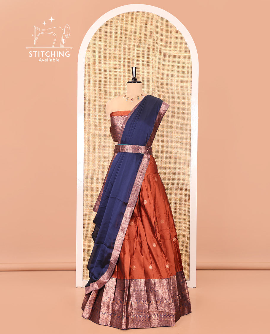 Rust and Blue Semi-Banarasi Half-Saree, Detailed with Zari Buttas on Its Skirt, Complemented by a Contrast Traditional Zari-Design Border, Paired with a Matching Blouse, and a Contrast Satin Georgette Zari-Bordered Dhavani