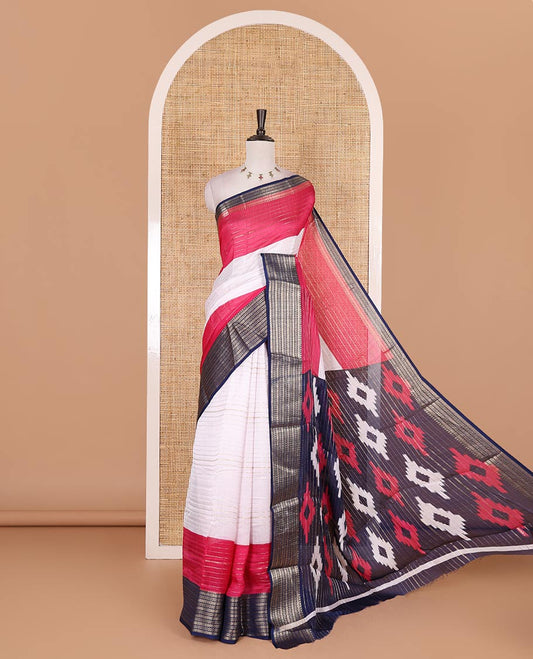 White zari design moss milan saree, contrast navy blue and pink colored traditional zari border, ikkat buttas printed pallu, and contrast zari design blouse