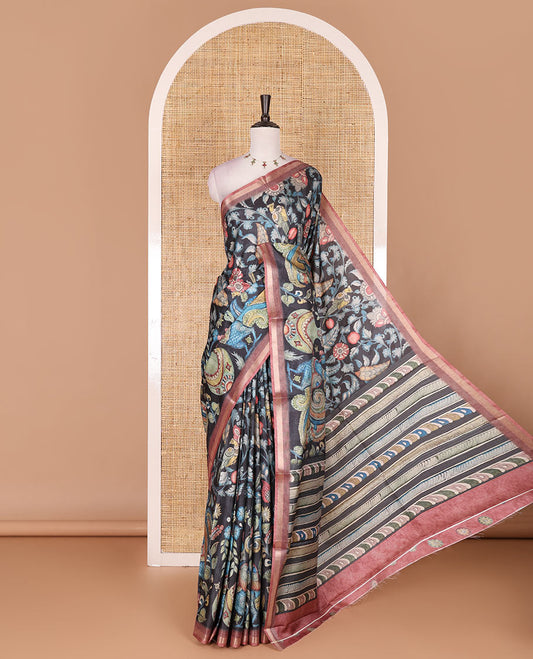 Black-base multi-color kalamkari floral-vine and peacocks printed semi-tussar saree, gold zari piping border, kalamkari printed pallu, and contrast printed blouse