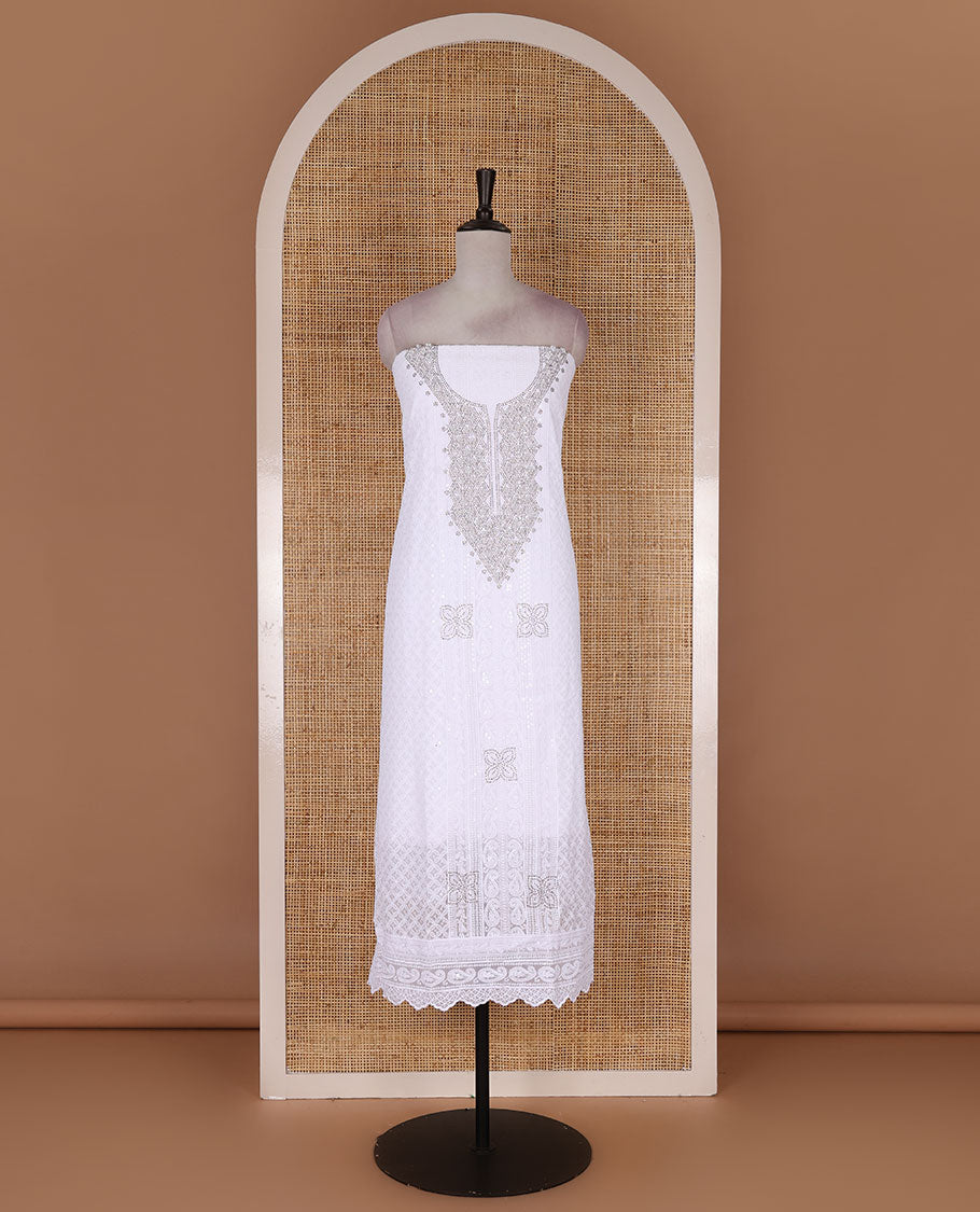 White material churidar set, stone work with Schiffli style embroidered georgette top, American Crape bottom, and polka dotted printed mirror work dupatta