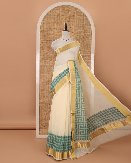 Cream with rama green kerala cotton saree , diamond style printed with gold zari tissue bawanchi border & diamond pattern printed pallu with plain blouse