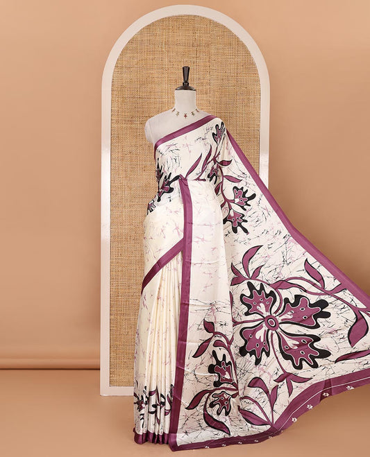 Cream-base batik-style floral printed satin crepe saree, contrast dark lavender border, printed pallu & contrast floral printed blouse