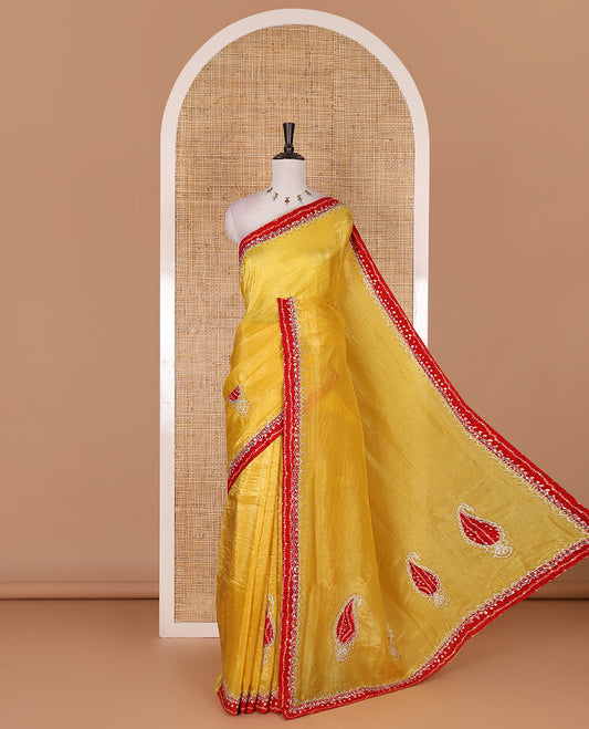 Yellow bandhani mango jhumka patch embroidered crunchy crushed saree, contrast border, and pallu of Swarovski stonework, bandhani dots, and bandhani printed blouse