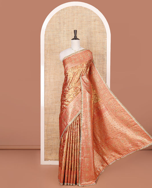 Gold Vastrakala Silk Saree, Decorated with Floral Jaal and Stone Work, Complemented by Contrast Traditional Zari and Stone Embroidered Scallop Border, Gleaming Grand Zari-Stone Work Pallu, and Paired with Contrast Heavy Stone Embroidered Blouse
