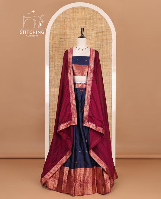 Navy blue taffeta silk half saree, floral zari buttas with contrast maroon traditional zari border skirt, matching zari design blouse, and contrast plain zari border syska georgette dhavani