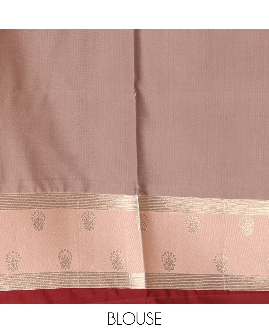 Maroon zari buttas soft silk saree, contrast zari border of intricate designs, zari-rich jaal pallu, and a contrast zari design blouse