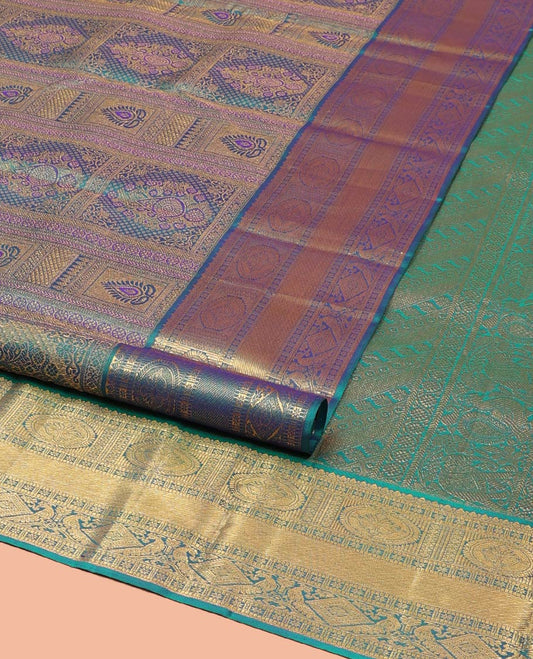Blue Kanchipuram Wedding Silk Saree, Masterfully Woven with Jacquard Design on Its Body, Highlighted by a Zari Border of Thilakam, Chakram, Diamond, and Mayil Designs, Majestically Detailed Pallu, and Paired with a Matching Blouse