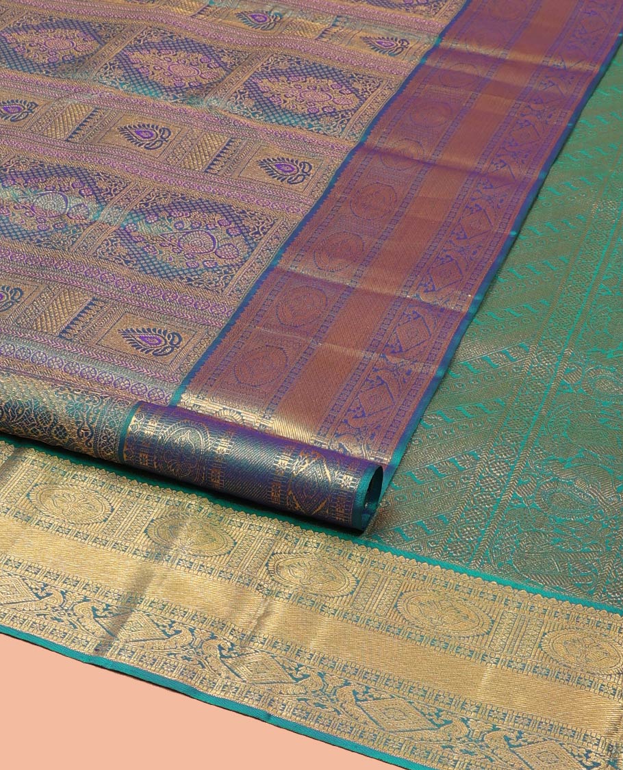 Blue Kanchipuram Wedding Silk Saree, Masterfully Woven with Jacquard Design on Its Body, Highlighted by a Zari Border of Thilakam, Chakram, Diamond, and Mayil Designs, Majestically Detailed Pallu, and Paired with a Matching Blouse
