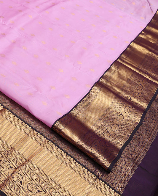 Lavender Vasundhara Lite Silk Mix Saree, Subtly Sparkled With Zari Buttas All Over Its Body, Complemented by Contrast Border of Salngai, Mayil Kann, Kamalam, and Dhavana Kodi Designs, Grand Jaal Pallu and Paired with a Contrast Blouse