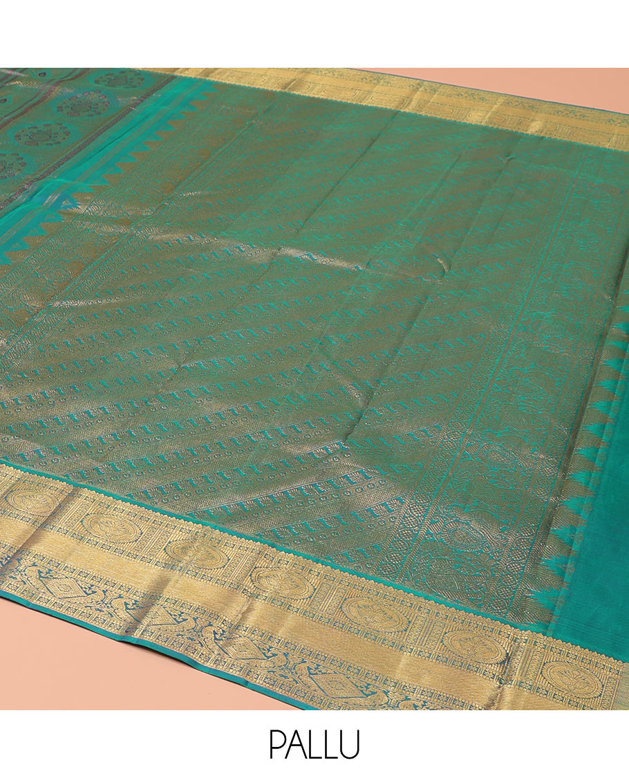 Blue Kanchipuram Wedding Silk Saree, Masterfully Woven with Jacquard Design on Its Body, Highlighted by a Zari Border of Thilakam, Chakram, Diamond, and Mayil Designs, Majestically Detailed Pallu, and Paired with a Matching Blouse