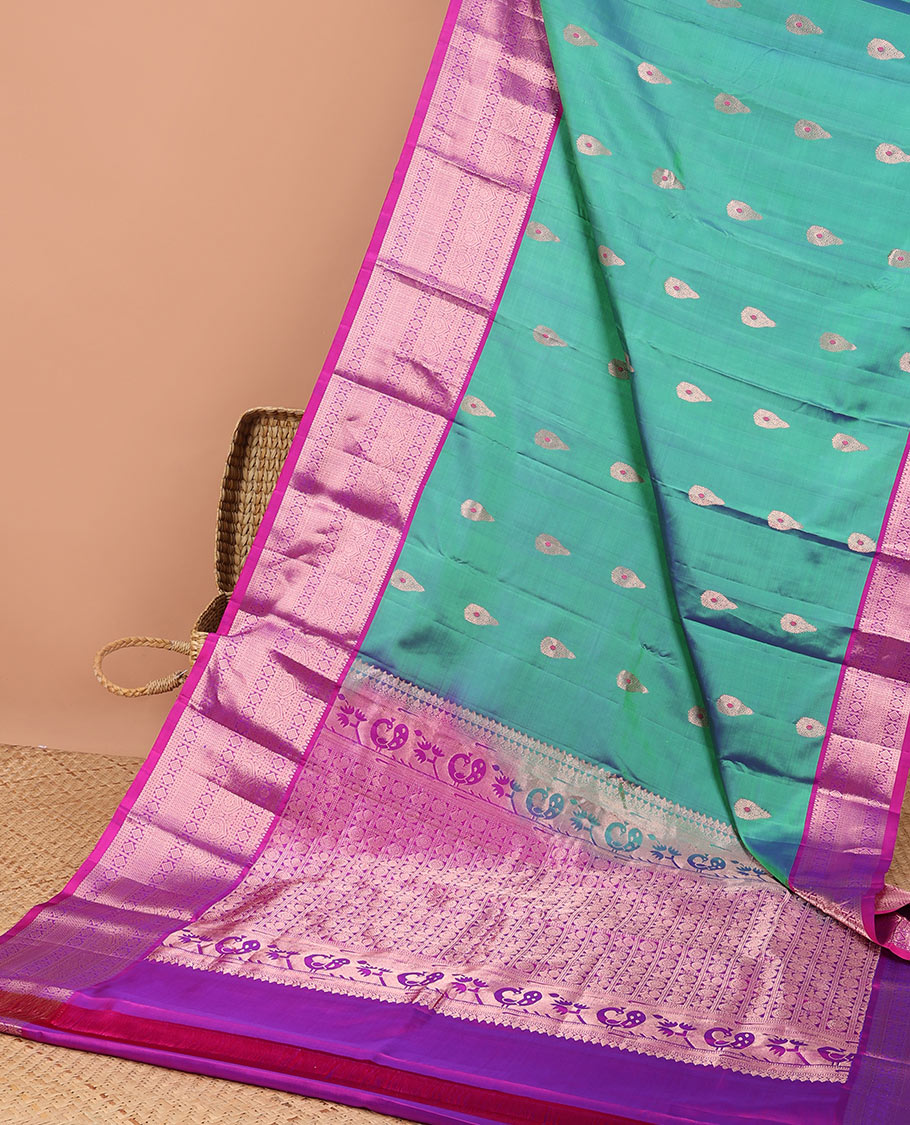 Green buttas kancheepuram silk saree with contrast intricate zari border & animal, floral enclosed checked design pallu