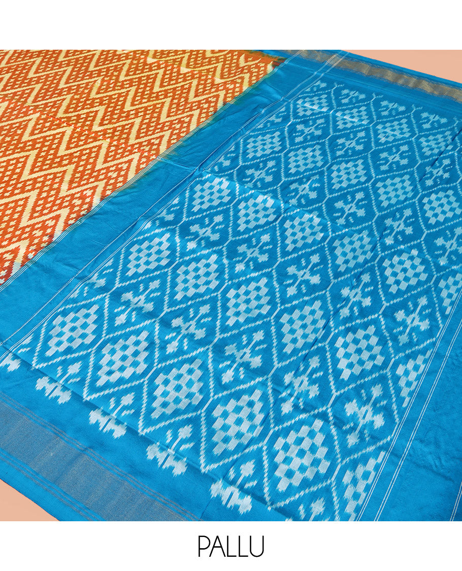 Orange Pochampally Ikat Silk Saree, Ornamented with Buttas and Chevron Design on Its Body, Complemented by a Contrast Border, Pallu of Jaal Designs in Ikkat Weave, and Paired with a Contrast Blouse