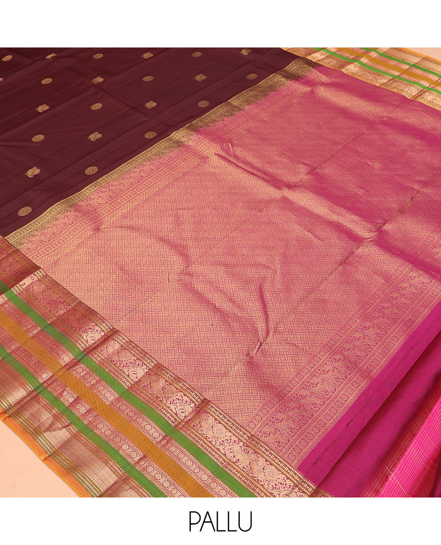 Brown Vasundhara Silk Saree, Delicately Woven with Mayil-Chakram Buttas, a Contrast Border of Kathir, Mayil, Yaanai, Muthu, Neli, and Laddu Kamalam Designs, a Grand Pallu, and a Contrast Blouse